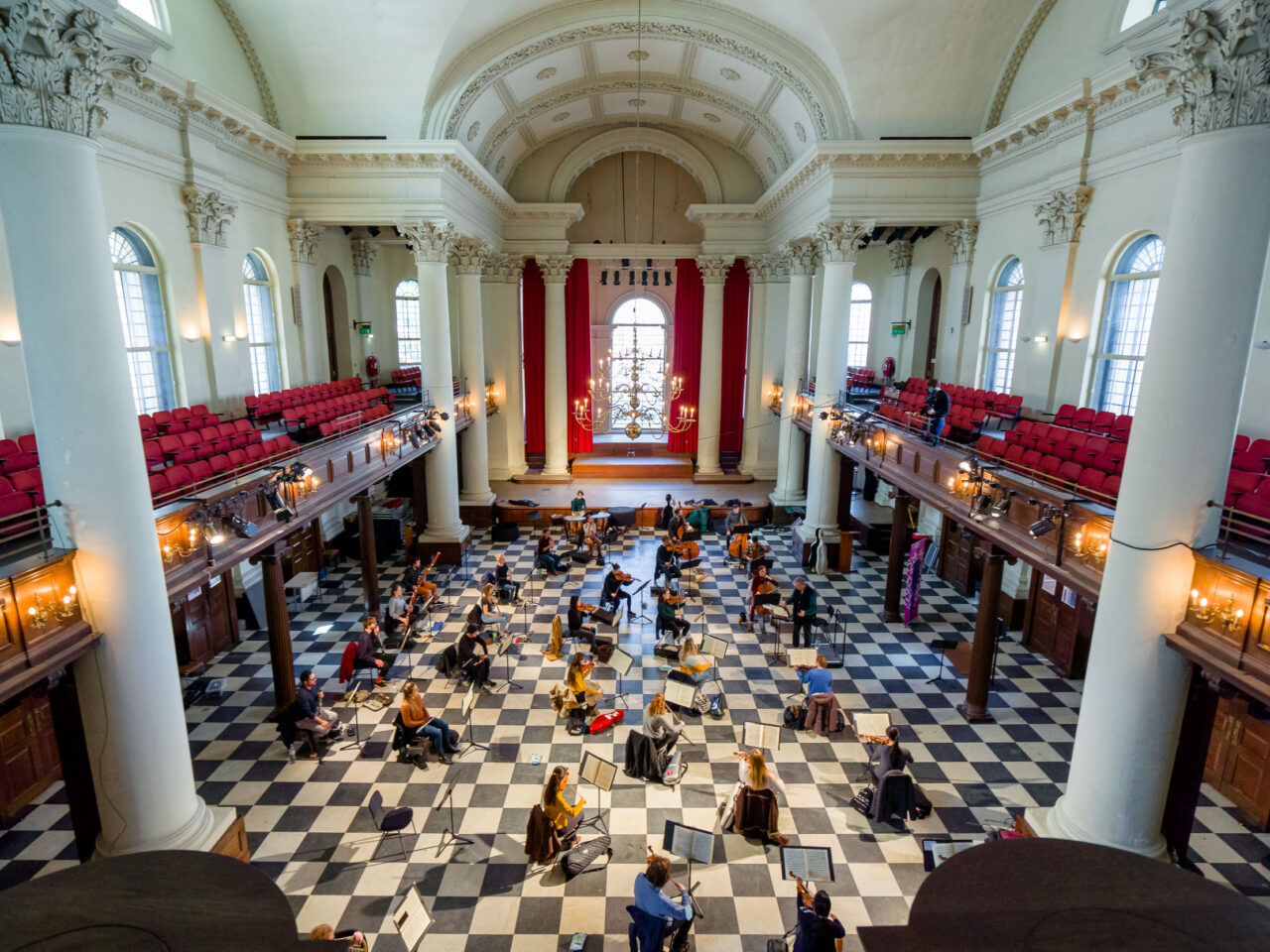 Featured: black and white checkered floor, canopy ceiling, columns